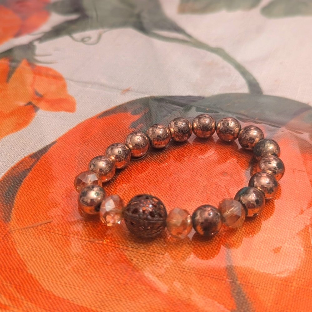 Pink, copper and turquoise beads on stretchy band